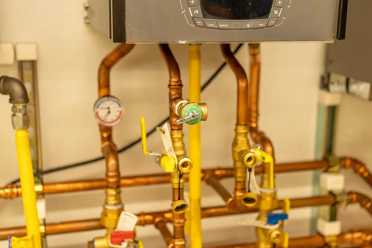 Licensed technician providing Water Heater Installation for a homeowner in Houghton